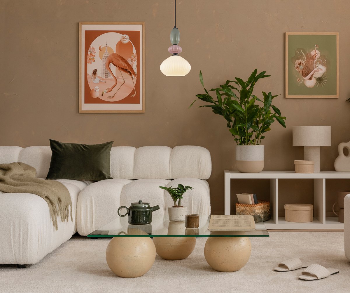 Warm and cozy, autumn beige composition of living room interior with green plants, mock up poster frame, art, boucle sofa, stylish coffee table, patterned rug, marble lamp and personal accessories. Home decor. Template.